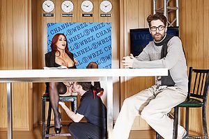 Redheaded newscaster with black stockings gets fucked on air