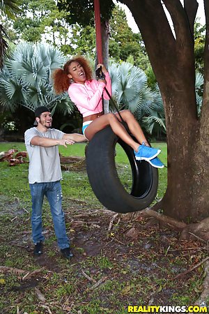 Kendall Woods in Round and Brown: Curly-haired ebony teen climbing tees and getting fucked outdoors