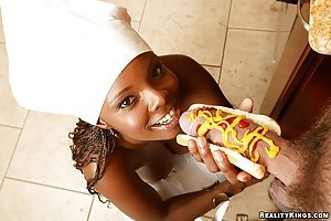 Stacy Adams in Extreme Naturals: Ebony cook dressed in her tiny white apron gets to taste a huge sausage