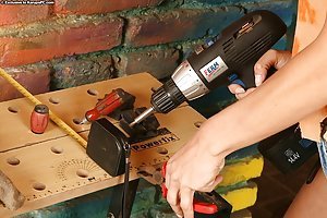 Endy in Karups Private Collection: Pigtailed MILF in denim shorts operating power tools and fingering