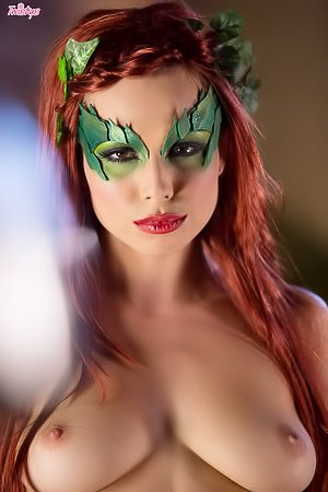 Redheaded Poison Ivy chick decides to tease her pussy with a toy