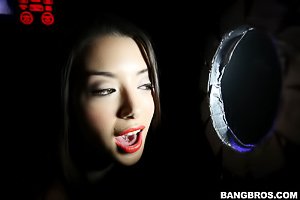 Glory hole action with a seductive dark-haired teen in a bikini