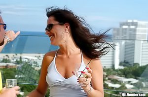 Dark-haired bombshell fingering herself and taking a meaty cock