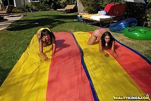 Essence Beauty & Cali Sunshyne in Round and Brown: Ebony chicks with fine asses showing off their bodies and fucking outdoors